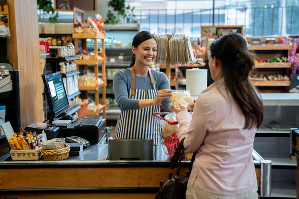 Woman at the cashier in a grocery store